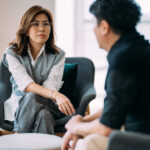 A man and a woman sitting in conversation