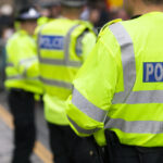 British police officers attend a crime scene