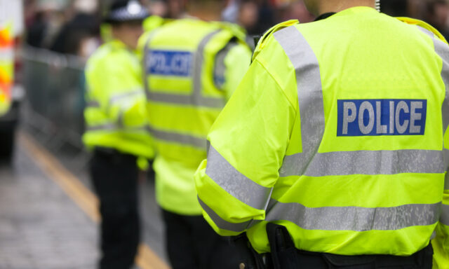 British police officers attend a crime scene