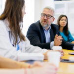 Group of medical team and business people meeting