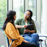 Two women sitting in conversation