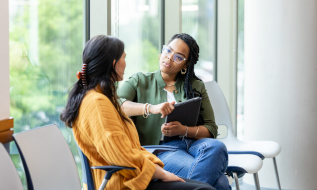 Two women sitting in conversation